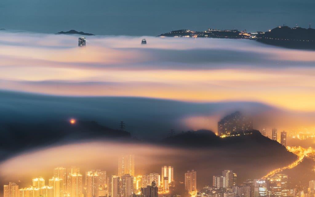 Articoin's Green NFT, Hong Kong Sky Scrappers Within A Sea of Cloud [ Photo Credit - Anthony Lau, National Geographic Travel Photographer Of The Year ]